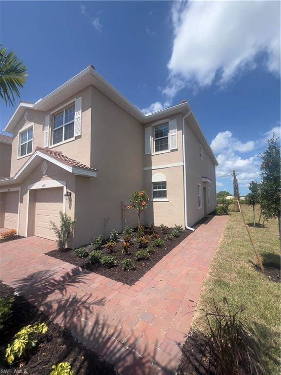 View of side of property featuring a garage