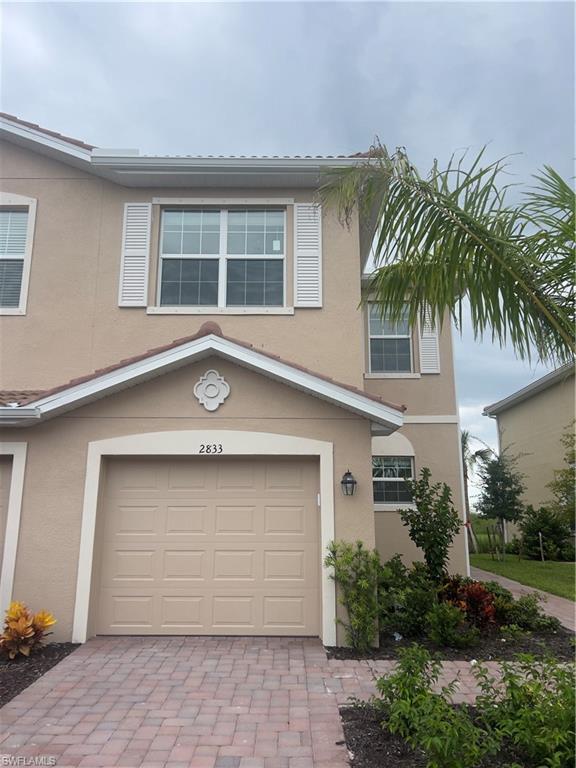 View of front of property with a garage