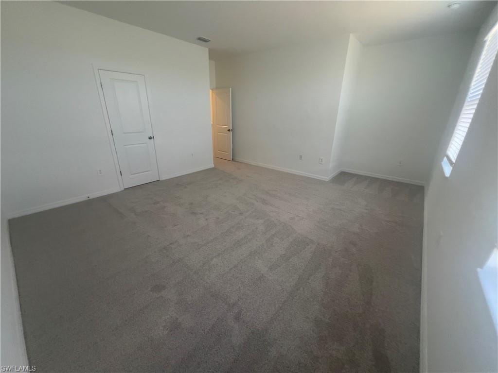 Unfurnished room featuring carpet floors