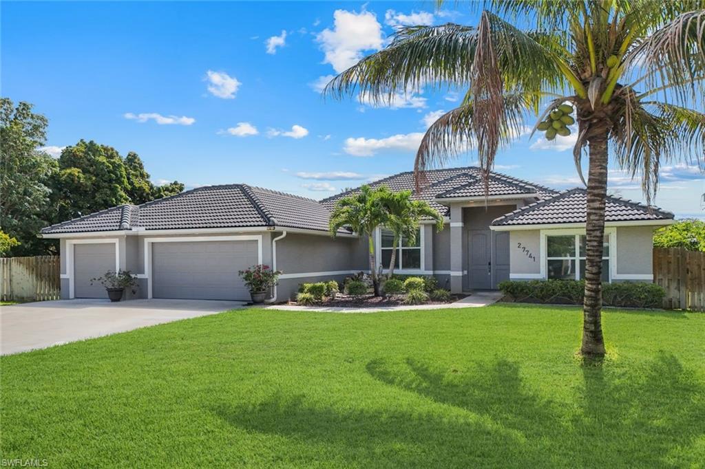 Single-story residence featuring a gray exterior and dark tiled roof