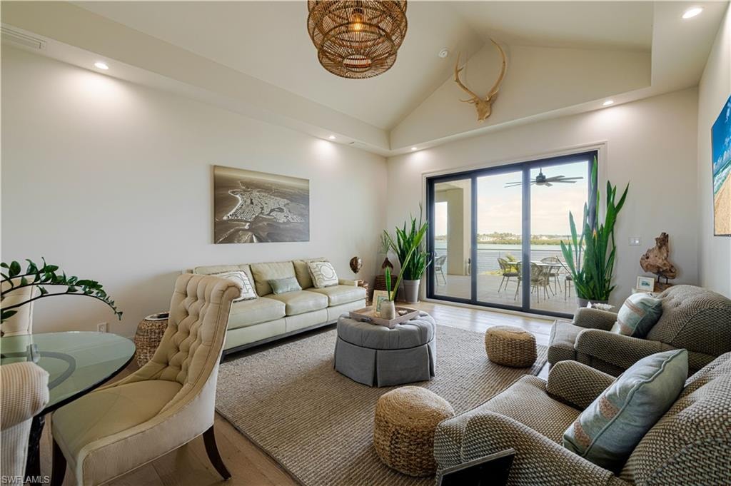 Expansive living area featuring a vaulted ceiling and recessed lighting