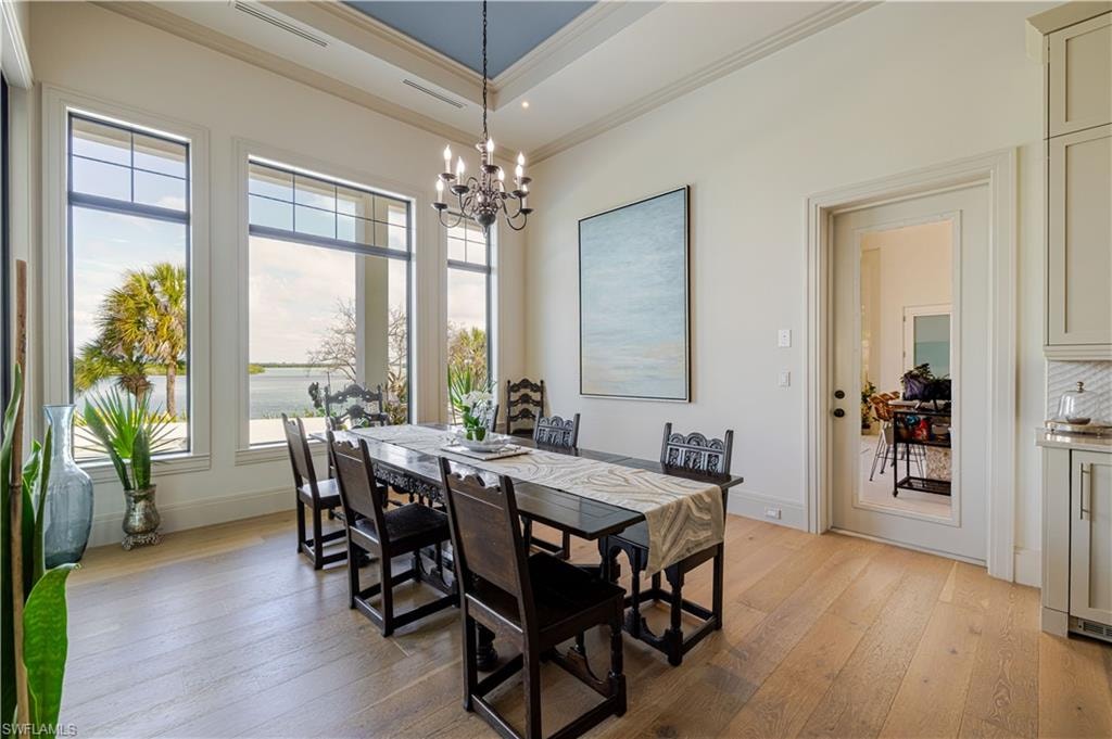 Dining area with light wood-finish flooring