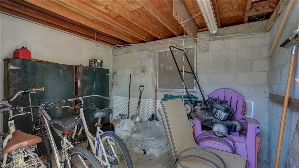 This storage room is off rear patio and could easily be turned into a man cave, work room, hobby room, whatever but great extra storage room!