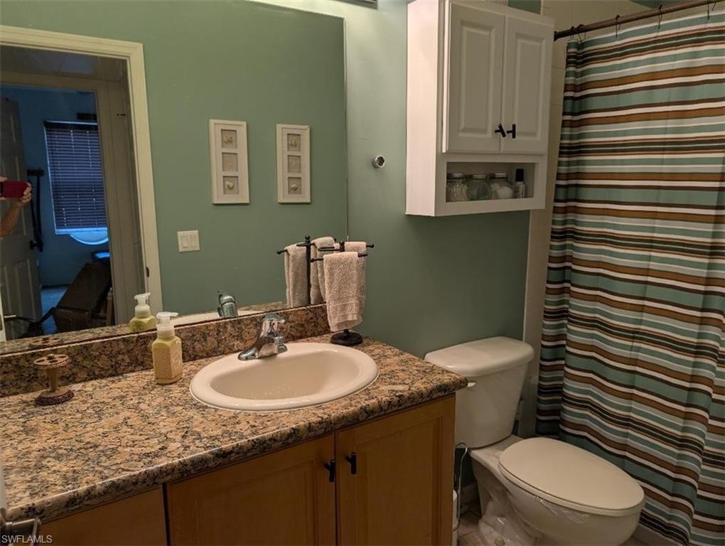 Bathroom featuring vanity and a shower with curtain