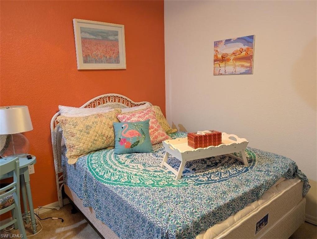 Bedroom featuring baseboards and carpet floors