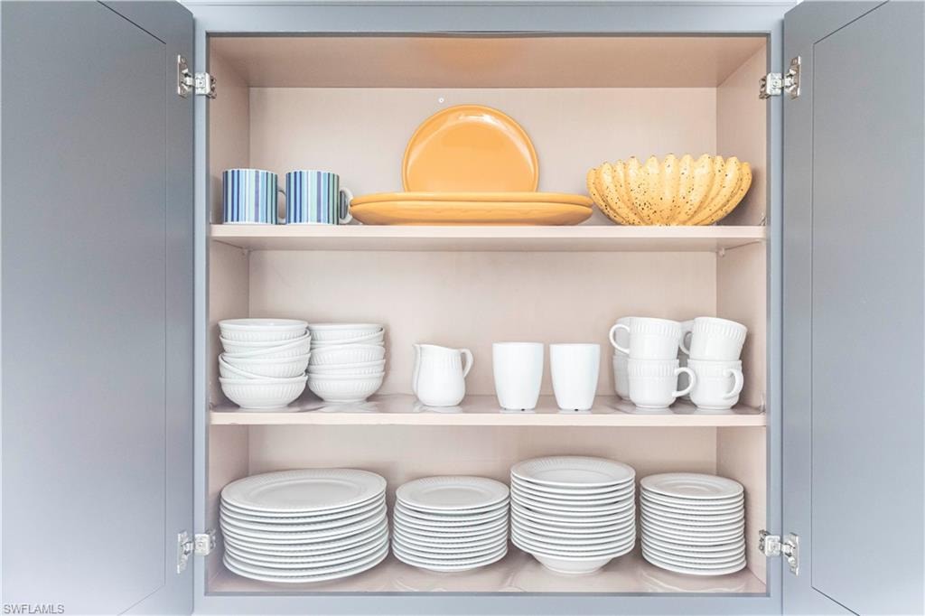 Gray cabinetry with interior shelving