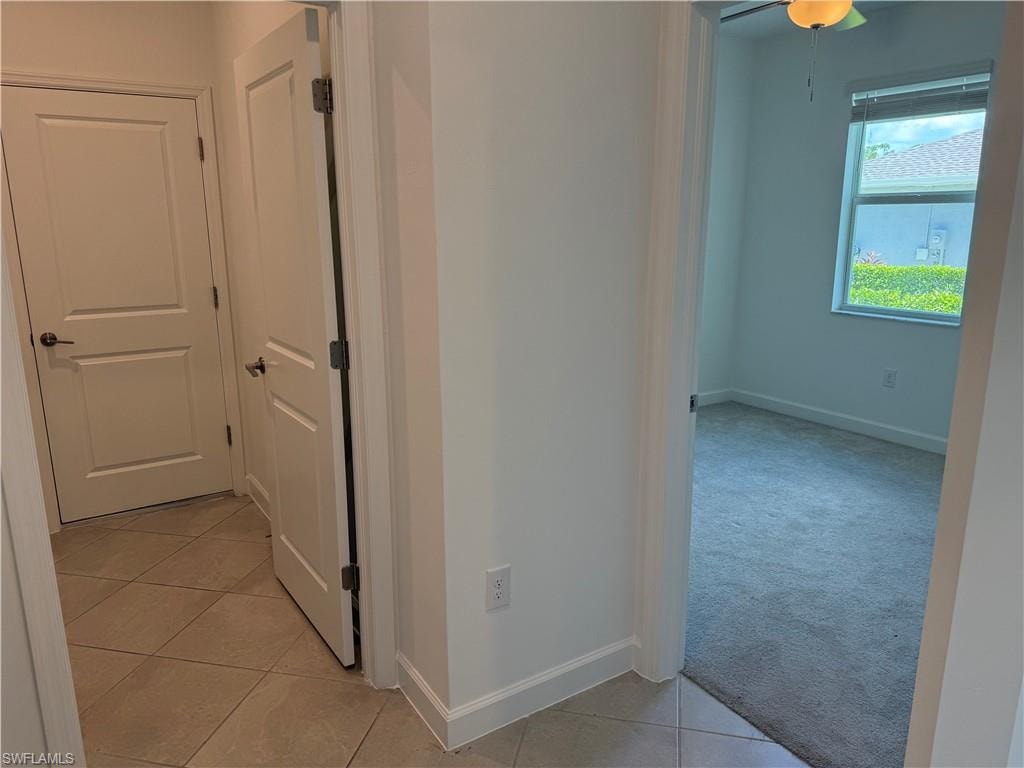 Hallway dividing bedroom 2 and laundry/garage