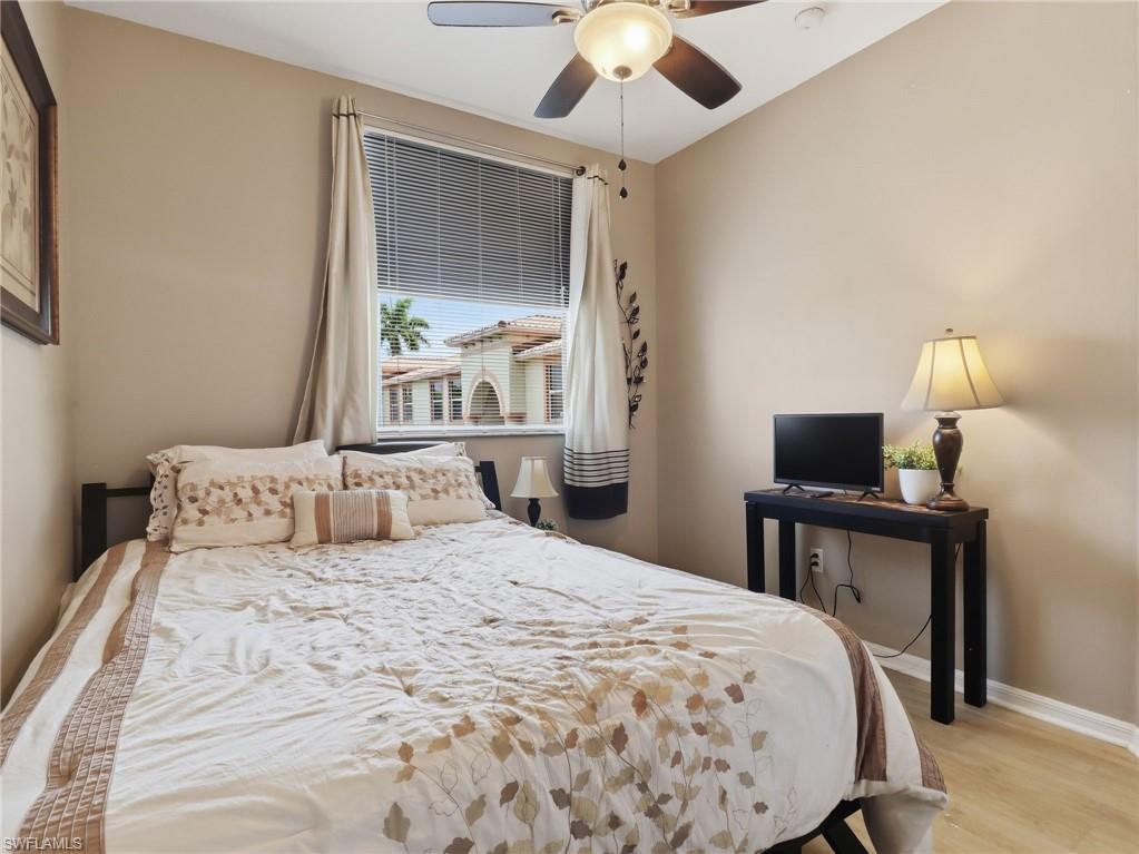 Neutral-toned room featuring light wood-finish flooring