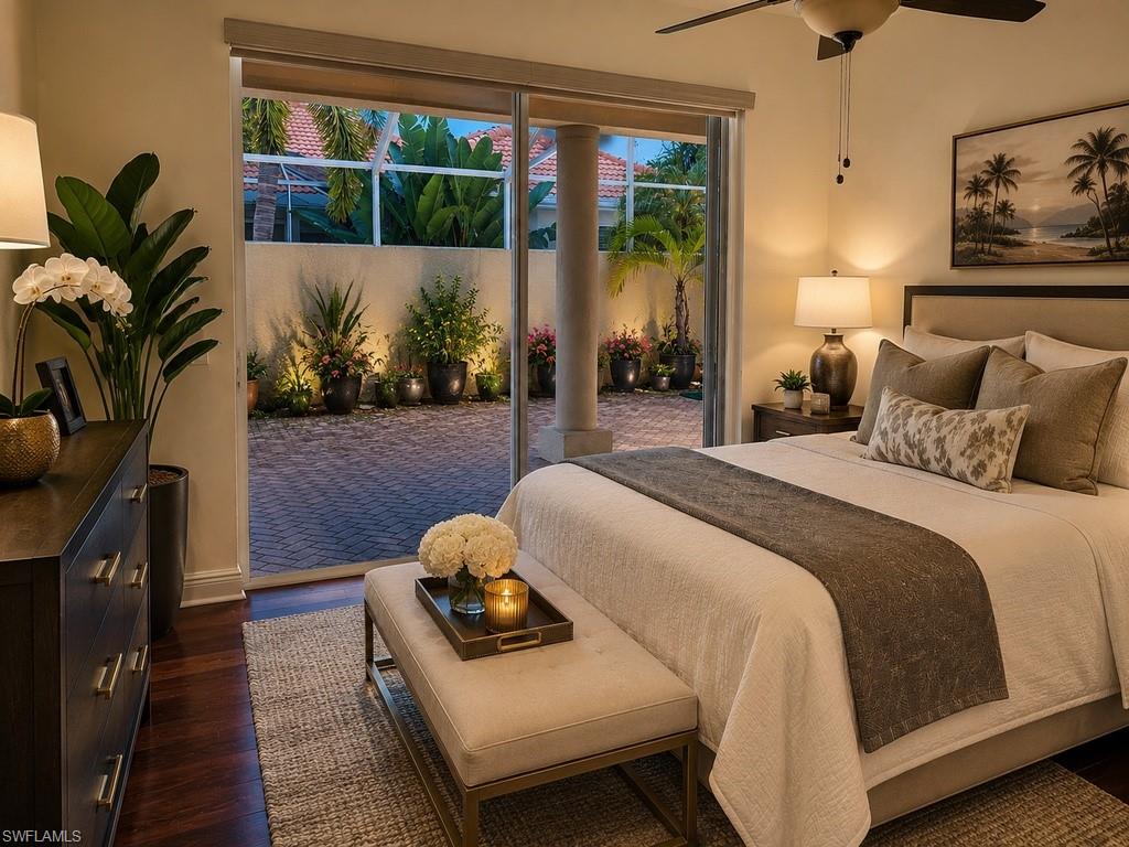 Bedroom featuring wood-finish flooring, a ceiling fan, and direct access to an outdoor paved patio