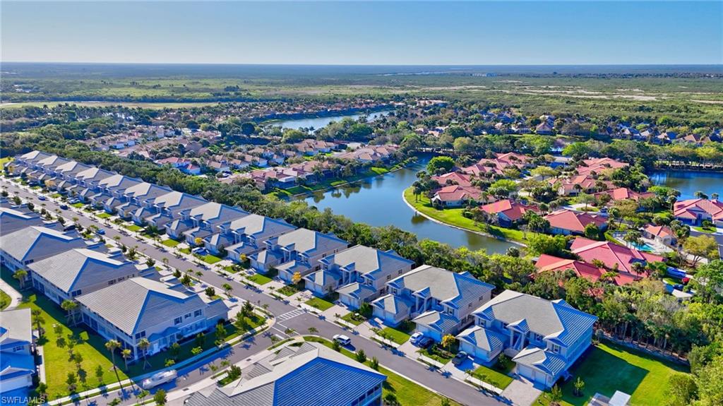 Aerial perspective showcasing a residential community with waterways and lush landscaping