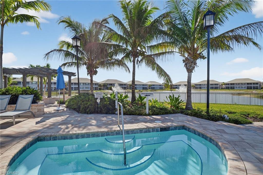 Spa with integrated steps and a surrounding paver deck