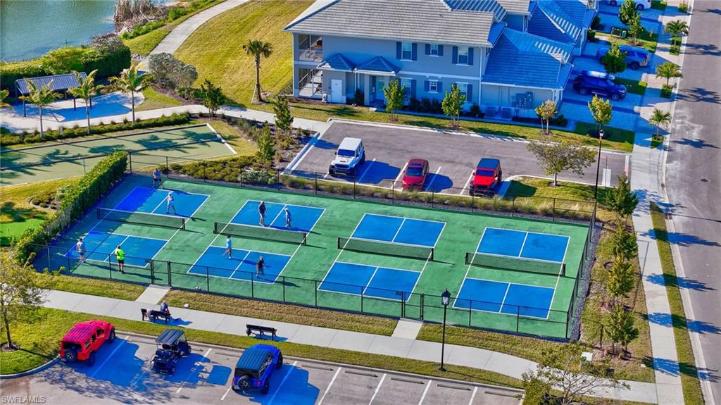 Multiple outdoor pickleball courts featuring blue and green surfacing