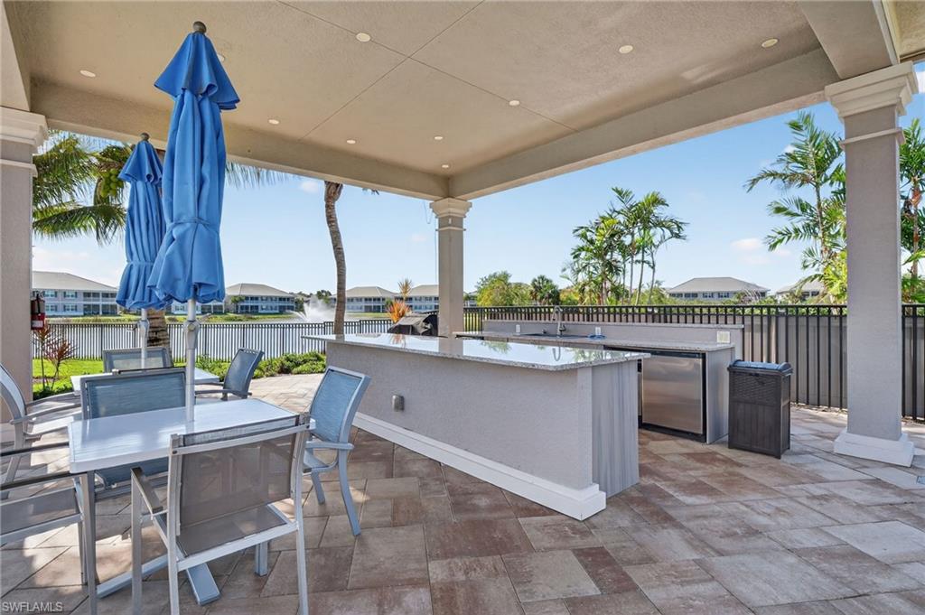 Covered outdoor patio featuring stone-finish flooring