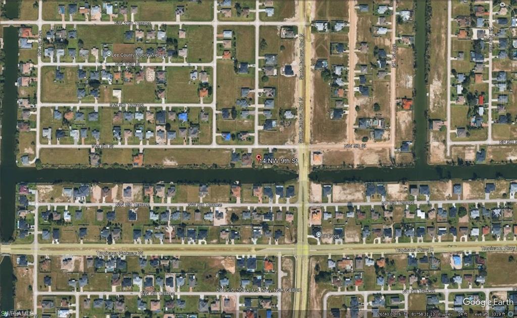 Aerial Imagery. Displaying a residential area with canal access and a grid street pattern