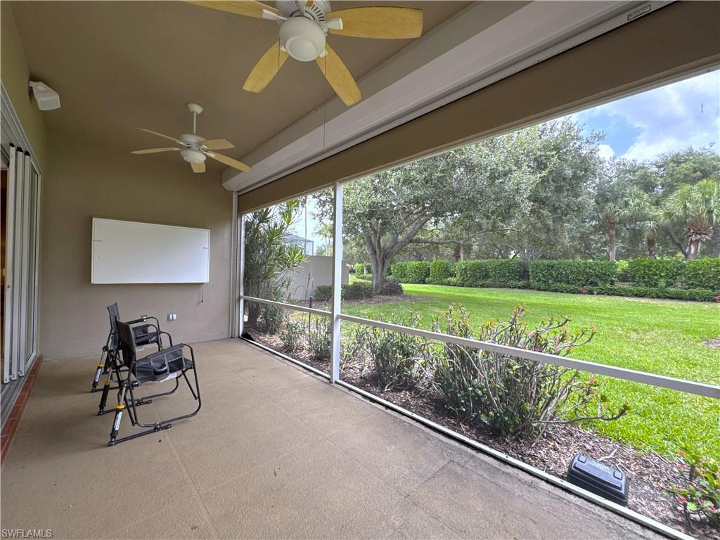 The screened lanai provides a peaceful outdoor retreat overlooking the beautifully landscaped backyard, creating the perfect setting for morning coffee, evening relaxation, or enjoying the Florida sunshine year-round.