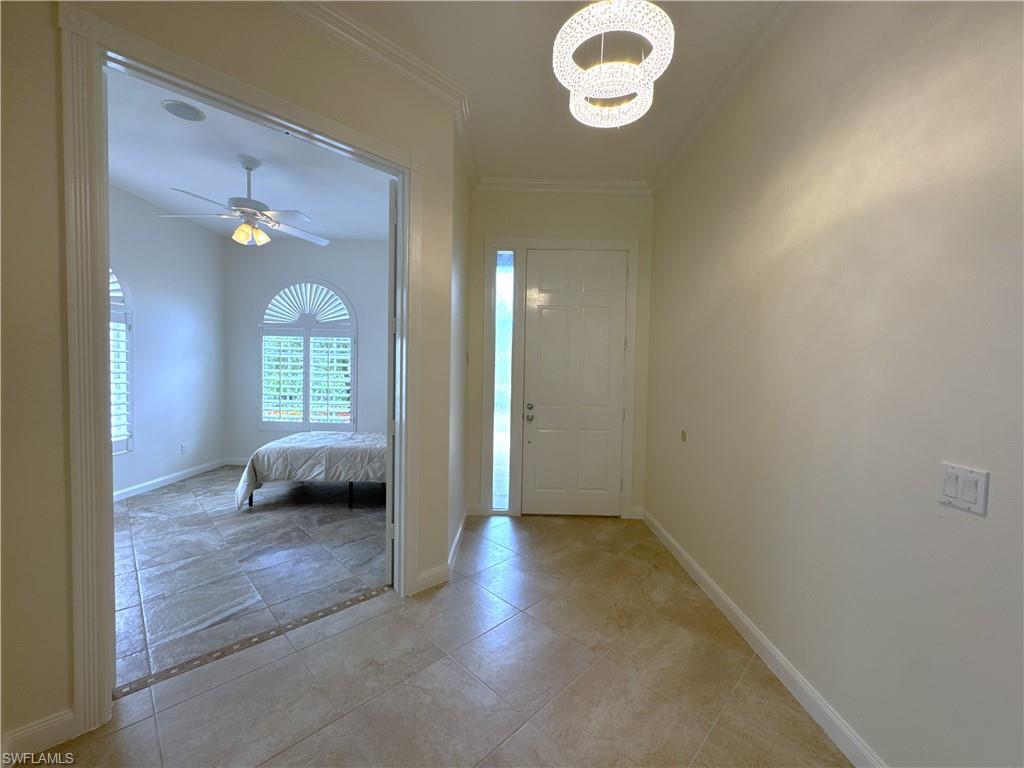 Beautiful light fixture in foyer.