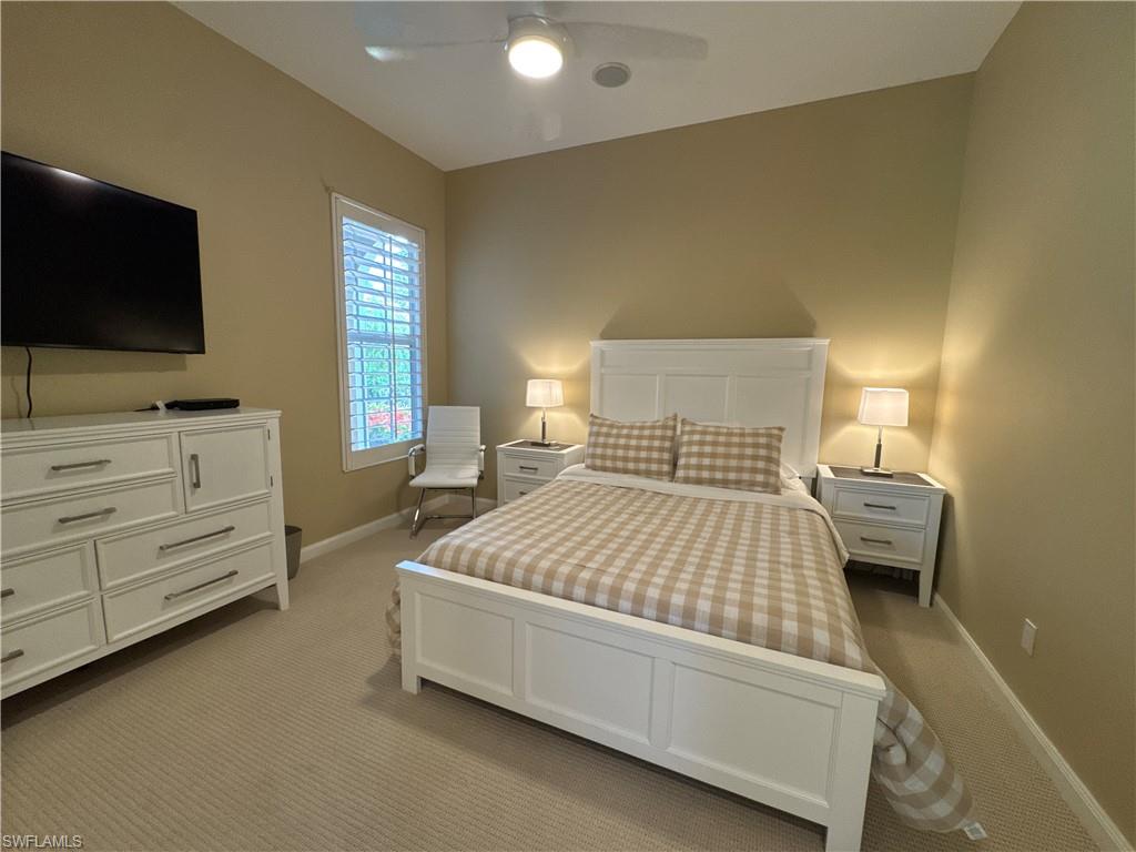 Guest Bedroom One with french doors.