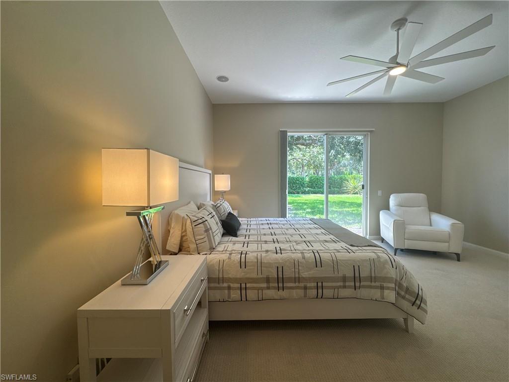 The spacious primary suite features a brand-new king-size bed with a never-used mattress, along with a comfortable power reclining chair—creating the perfect retreat after a day enjoying the Naples lifestyle or Village Walk's resort-style amenities.