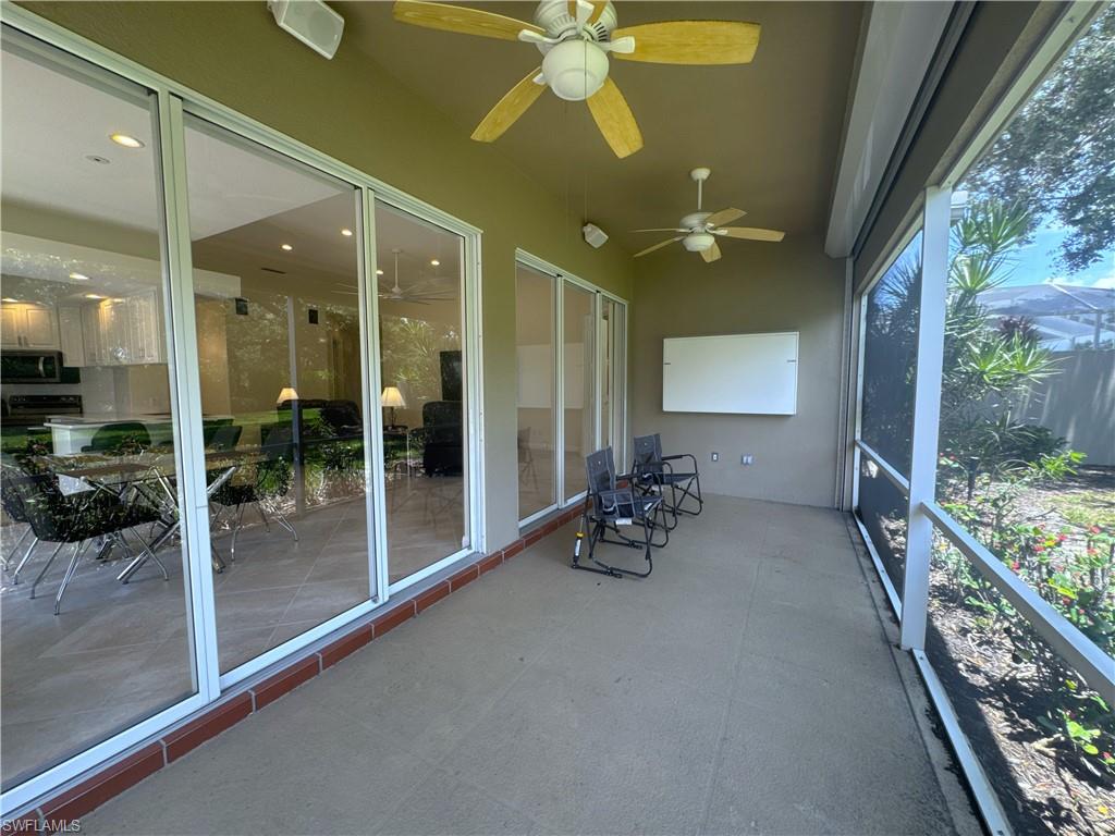 The screened lanai provides a peaceful outdoor retreat overlooking the beautifully landscaped backyard, creating the perfect setting for morning coffee, evening relaxation, or enjoying the Florida sunshine year-round.