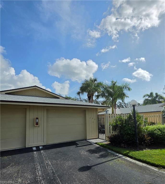 FRONT ELEVATION...ATTACHED GARAGE AND COURTYARD PATIO ENTRY...END-UNIT!!