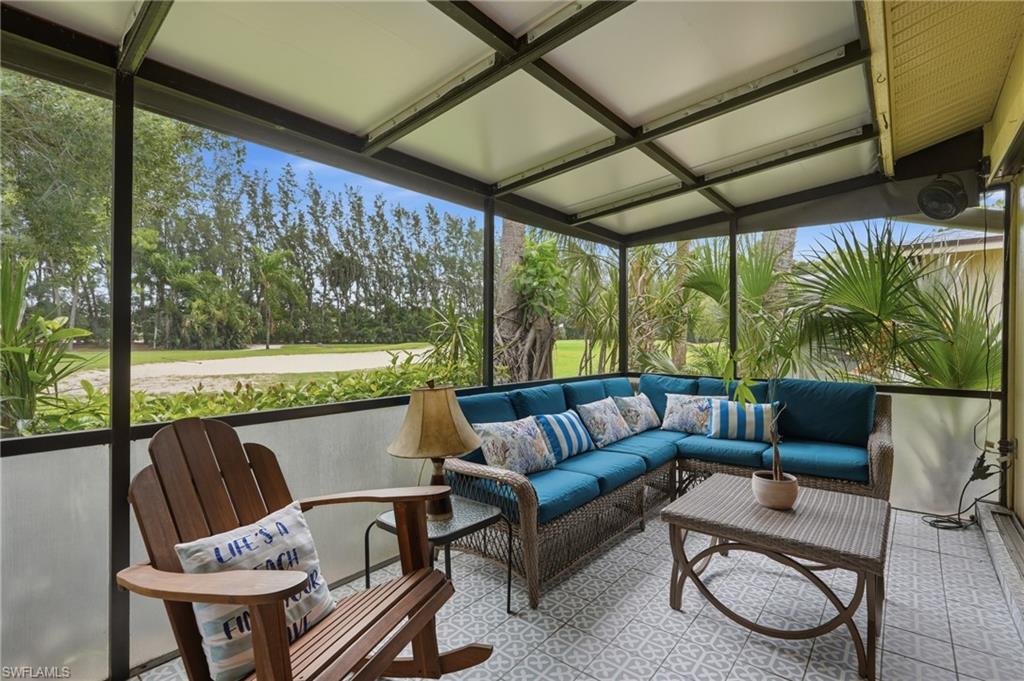 NICELY SIZED REAR SCREENED LANAI OVERLOOKING GOLF COURSE...POCKETING SLIDER DOORS TO BRING THE OUTSIDE IN!!!