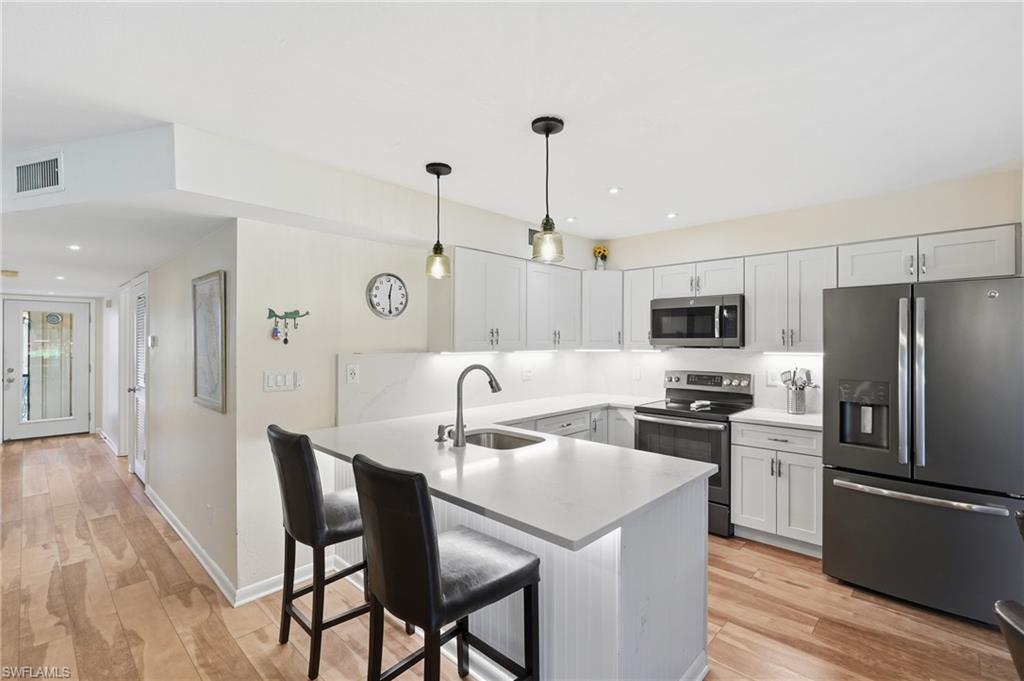 UPDATED CONTEMPORARY KITCHEN - SLEEK QUARTZ COUNTERS...
