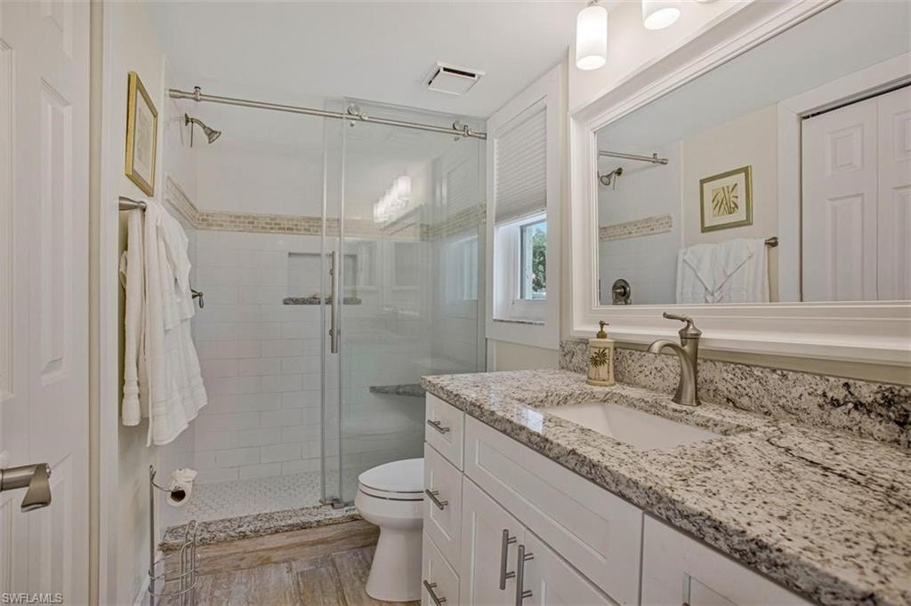 Step in shower in the en suite bath, large linen closet, newer vanity and toilet