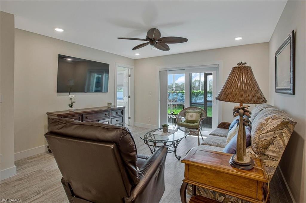 Recliner and sofa and a ceiling fan provide extra comfort