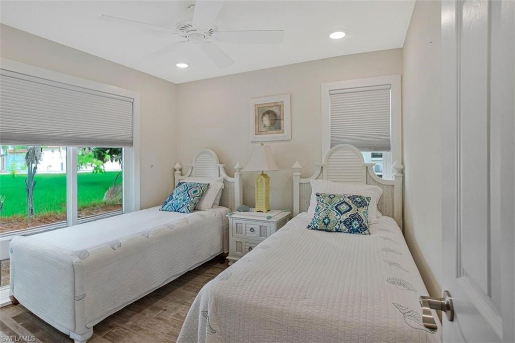 guest bedroom with closet and 3 piece bath just steps away  green fence is temporary