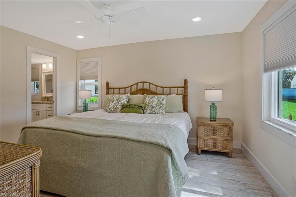 Owner's suite with ensuite bath and a tropical vibe