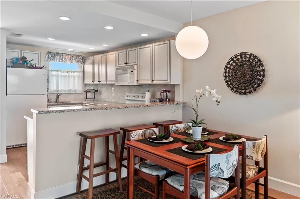 Dining room and kitchen, with granite counters