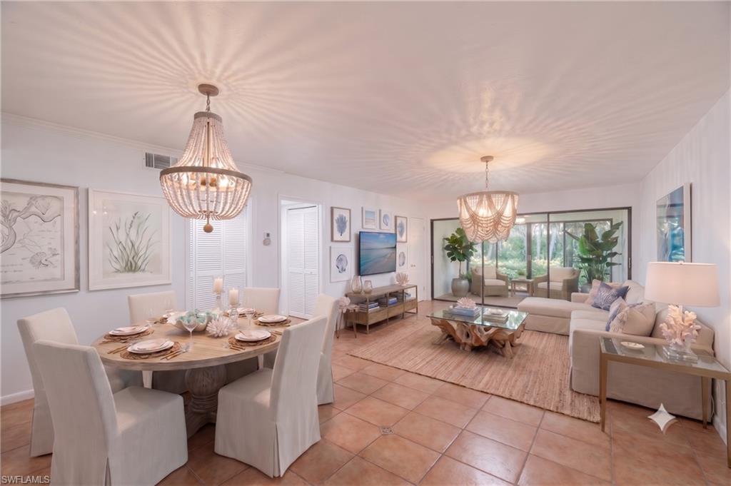 Open living and dining area that connects to  all season room virtually staged to provide design inspiration and ideas for furniture placement.