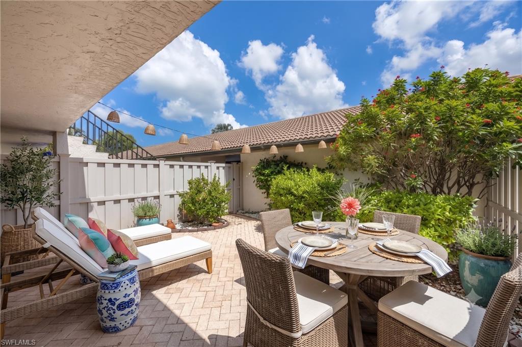 Garden courtyard adds private outdoor entertainment area that is unique to first floor units. This one has been virtually staged to provide design inspiration and ideas for furniture placement.