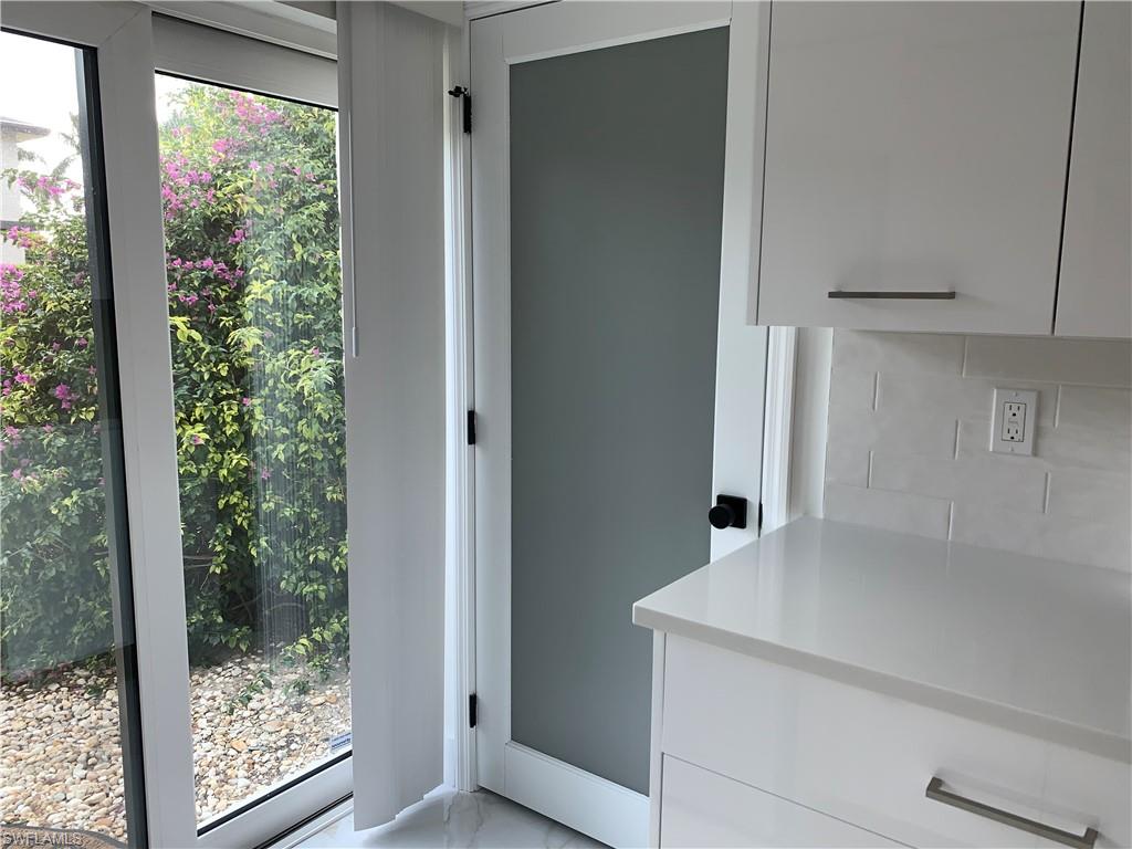 The opaque door leads to the Laundry room!