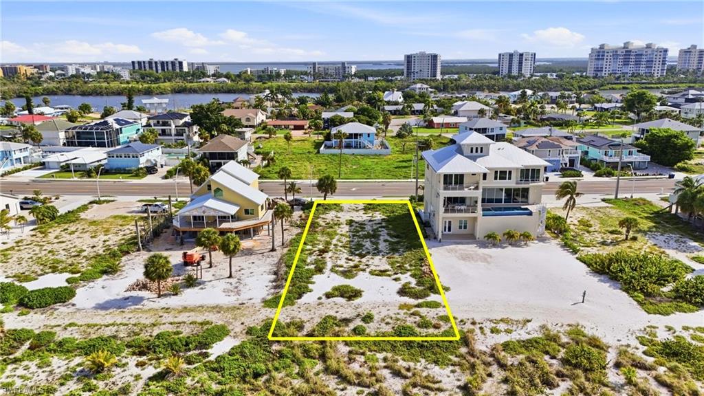 Vacant land parcel featuring sandy terrain and sparse vegetation - Virtually Edited Image