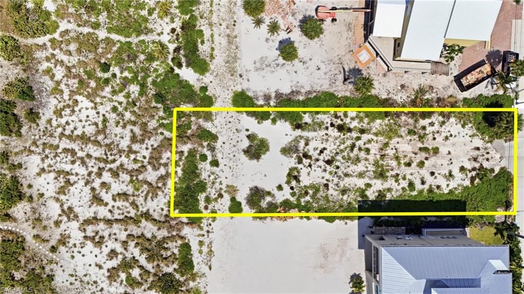 Expansive rectangular lot featuring natural vegetation and sand - Virtually Edited Image