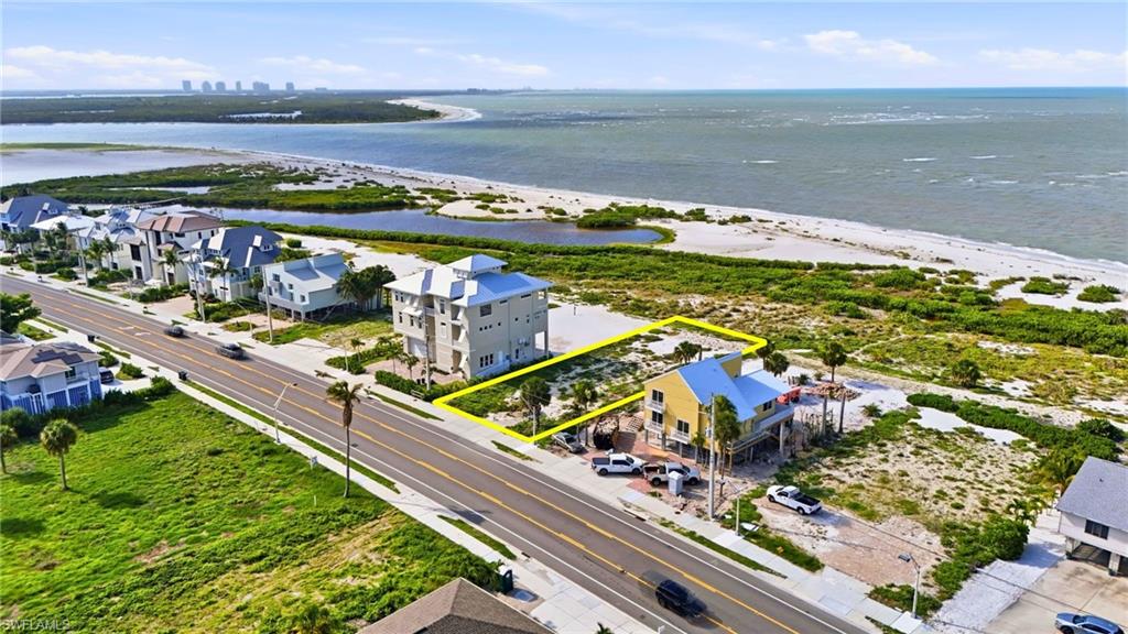 Expansive coastal property encompassing a cleared, buildable lot and direct beach access - Virtually Edited Image