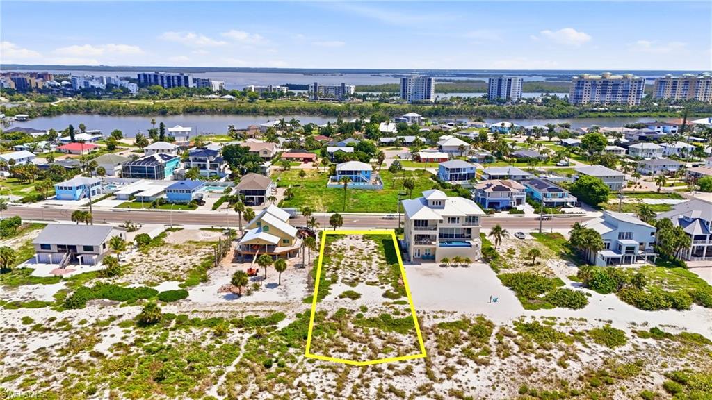 Beachfront lot featuring direct sand access and coastal vegetation - Virtually Edited Image