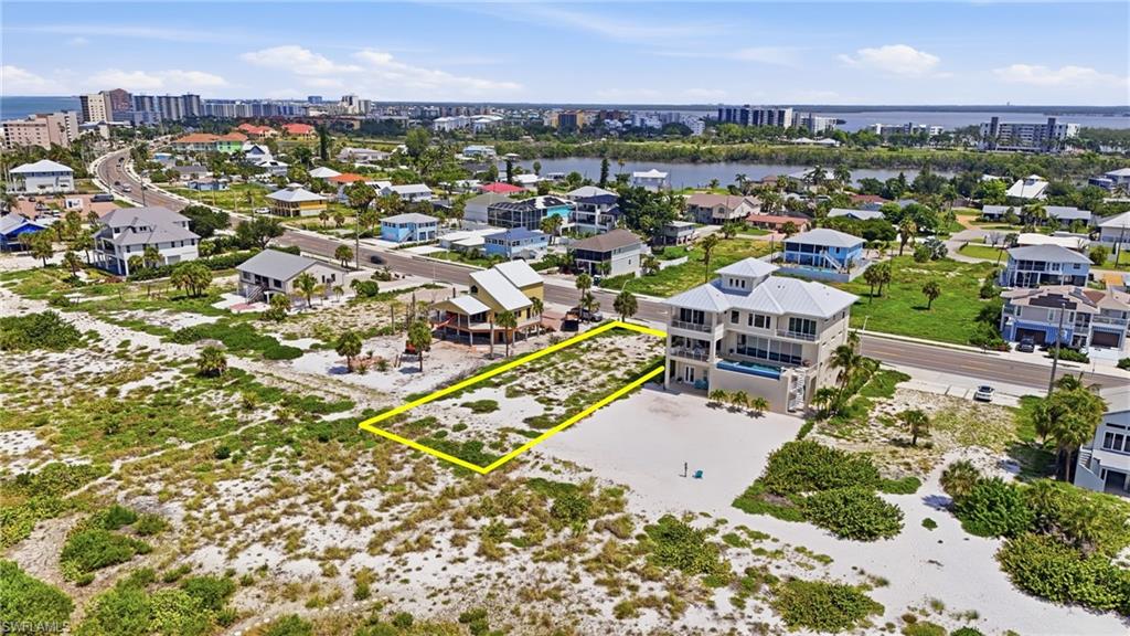 Vacant lot with sand and vegetation, highlighted by a yellow boundary - Virtually Edited Image