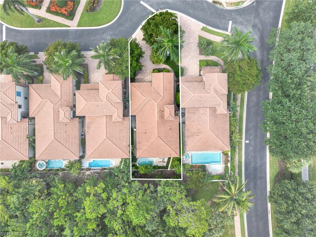 Aerial perspective highlighting the property's red tile roofing