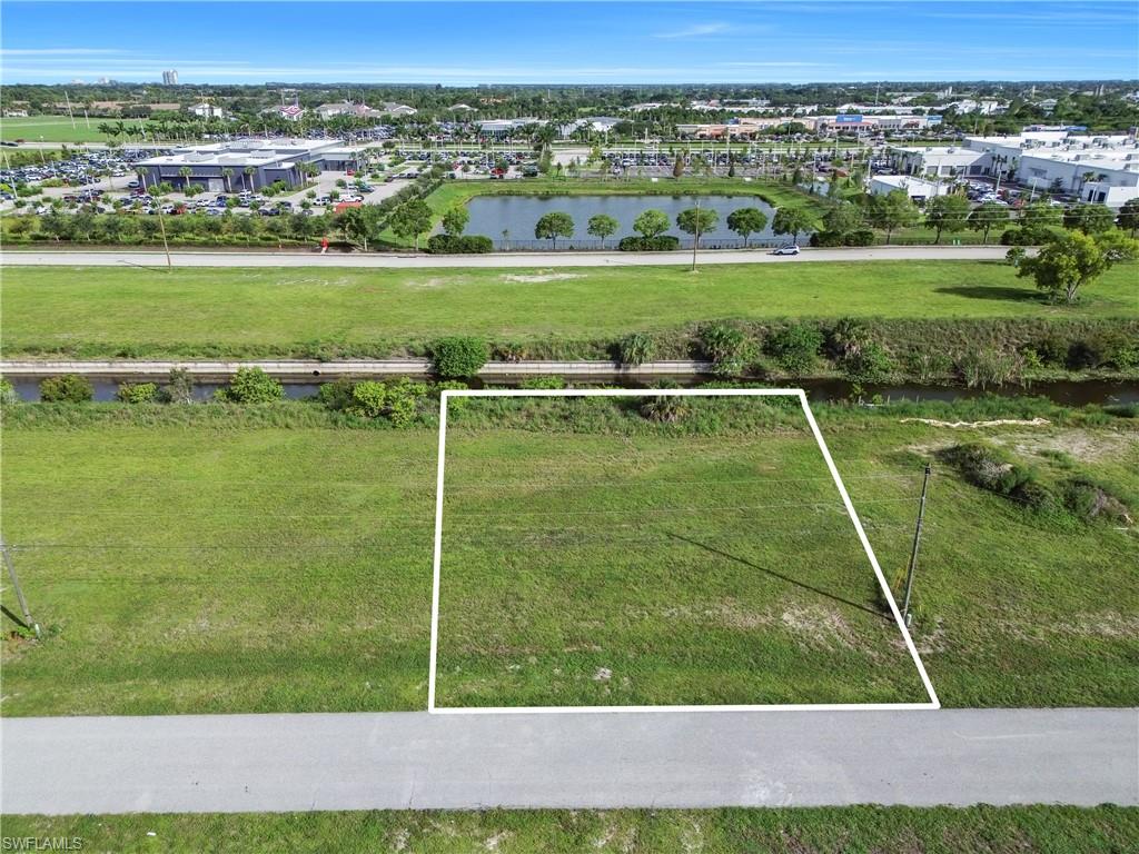 Expansive green lot with established perimeter boundaries