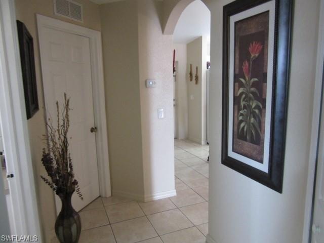 Neutral-toned walls complement the tile flooring