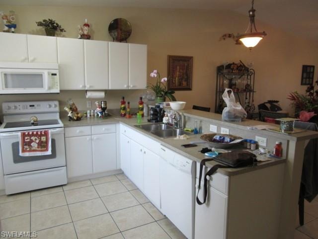 Kitchen featuring white cabinetry, a built-in microwave, a white electric range, and a double basin stainless steel sink