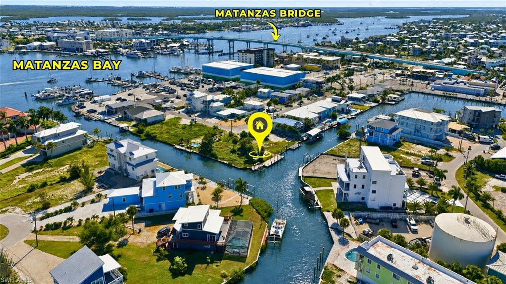 Waterfront property featuring canal frontage, boat access, and proximity to Matanzas Bay - Virtually Edited Image