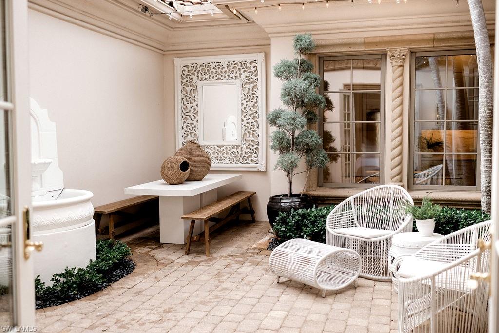 Mediterranean-style courtyard featuring a paver stone patio