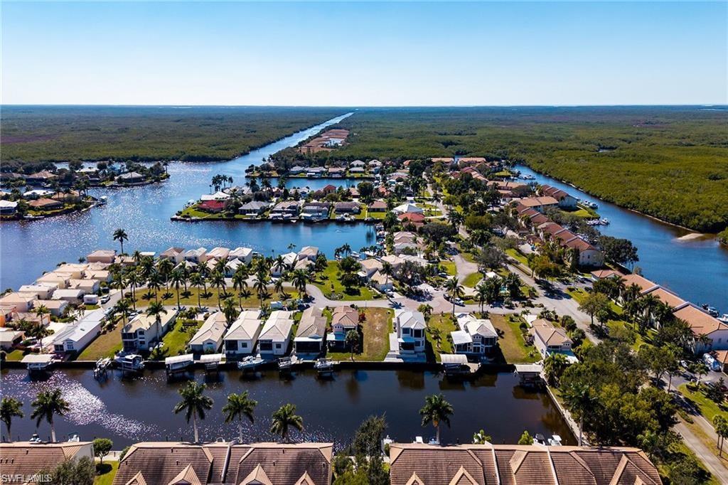 Waterfront community with direct canal access, surrounded by lush natural areas