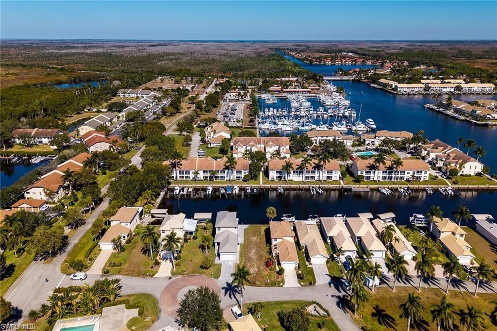 Aerial perspective showcasing a waterfront community with direct canal access