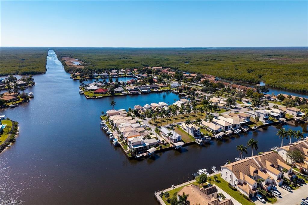 Aerial perspective showcasing a waterfront community with direct canal access