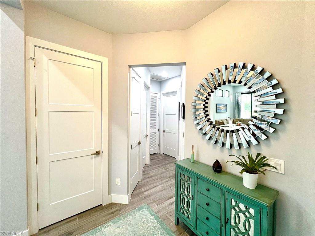 Hallway with wood-look tile flooring