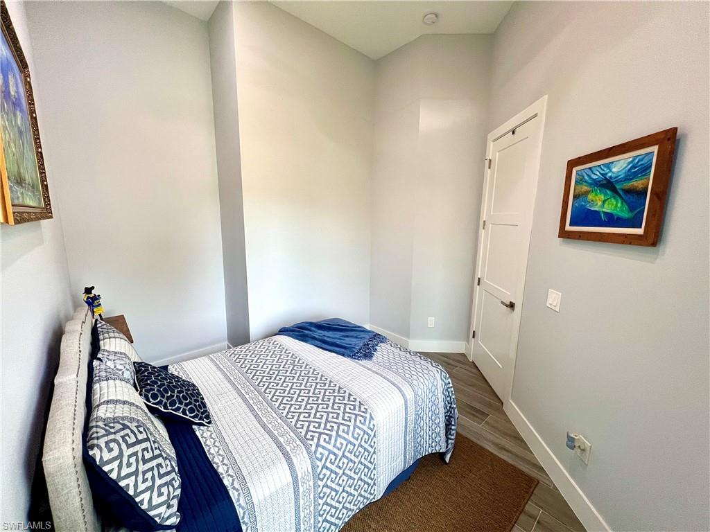 Light-toned walls complement wood-finish flooring in this room